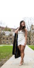 Anna Vento holding graduation gown